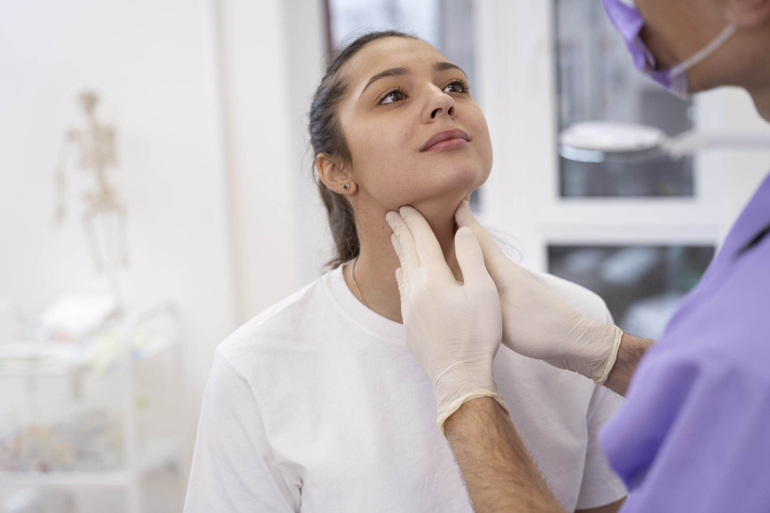 doctor-performing-routine-medical-checkup